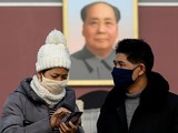 Người dân tại Bắc Kinh, Trung Quốc đeo khẩu trang đề phòng viêm phổi Vũ Hán. Ảnh: AFP.