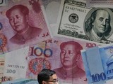 Chính quyền Trump coi Trung Quốc là nước "thao túng tiền tệ" sau khi để đồng NDT xuống giá so với đồng USD (Ảnh: Time)