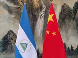 Quốc kỳ Nicaragua và Trung Quốc trước hội nghị được tổ chức tại Thiên Tân hôm 10/12 (Ảnh: Handout)