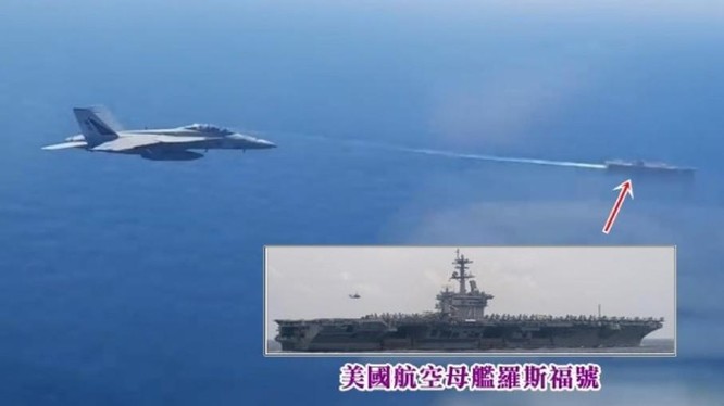 Hình ảnh trích video do máy bay Nga quay cho thấy chiếc F/A18 áp sát máy bay Nga, phía dưới là tàu sân bay Mỹ (Ảnh: Đông Phương).