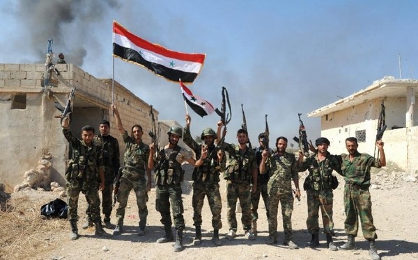 Quân đội của ông Assad ăn mừng sau khi giành chiến thắng trước lực lượng nổi dậy hôm 11/10.