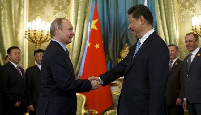 Tổng thống Nga Vladimir Putin (phải) và người đồng cấp Trung Quốc (ảnh tư liệu)