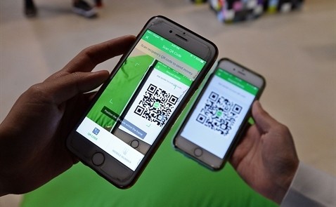 Grab vừa thêm tính năng cho phép người dùng thanh toán hóa đơn tại các cửa hàng bằng cách scan mã QR từ ví điện tử GrabPay by Moca.