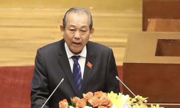 Phó Thủ tướng Trương Hòa Bình trình bày báo cáo trước Quốc hội. 