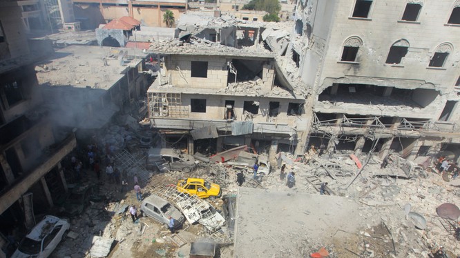 Khung cảnh hoang tàn sau một đợt không kích ở tỉnh Idlib, Syria (Ảnh: RT)