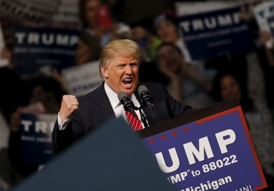 Ông Donald Trump trong một buổi vận động tranh cử tại bang Michigan. Ảnh: Reuters.