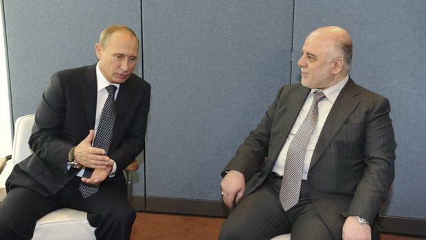 Tổng thống Nga Vladimir Putin trò chuyện với thủ tướng Iraq Haider al-Abadi tại New York trong cuộc họp của Đại hội đồng LHQ tháng 9 vừa qua - Ảnh: Reuters