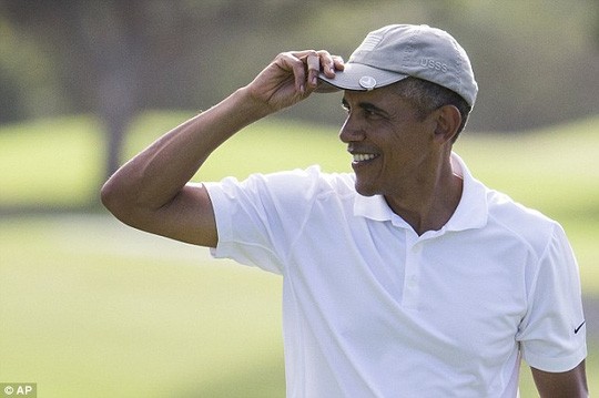 Tổng thống Barack Obama sẽ công bố các quy định mới về sử hữu súng vào tuần tới khi ông trở về từ kỳ nghỉ ở Hawaii. Ảnh: AP