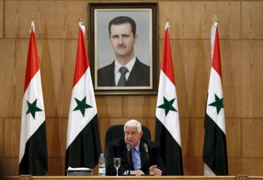 Ngoại trưởng Syria Walid al-Moualem phát biểu tại cuộc họp báo được truyền hình tại thủ đô Damascus hôm 12-3. Ảnh: Reuters