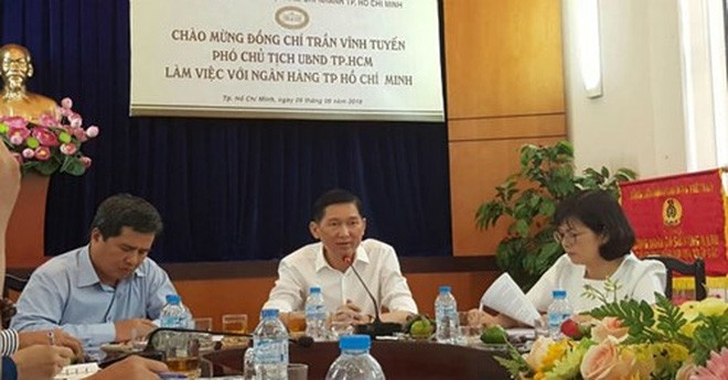 Ông Trần Vĩnh Tuyến (giữa), Phó Chủ tịch UBND TP.HCM làm việc với NHNN chi nhánh TP.HCM - Ảnh: Hà An