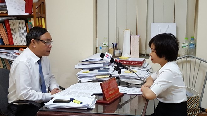 Thẩm phán Trương Việt Toàn trả lời phỏng vấn phóng viên TTXVN. (Ảnh: Nguyễn Cúc/Vietnam+)
