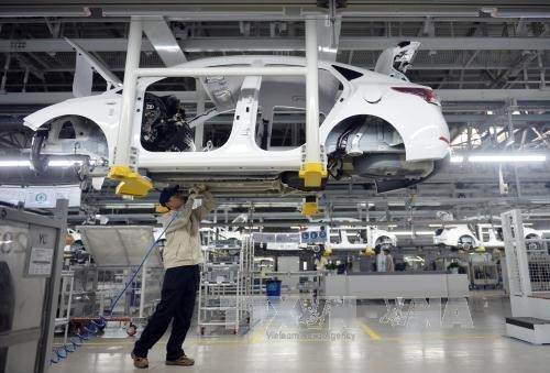 Dây chuyền sản xuất xe ô tô tại nhà máy của Hyundai ở Thương Châu, Hà Bắc, miền bắc Trung Quốc. Ảnh: AFP/TTXVN