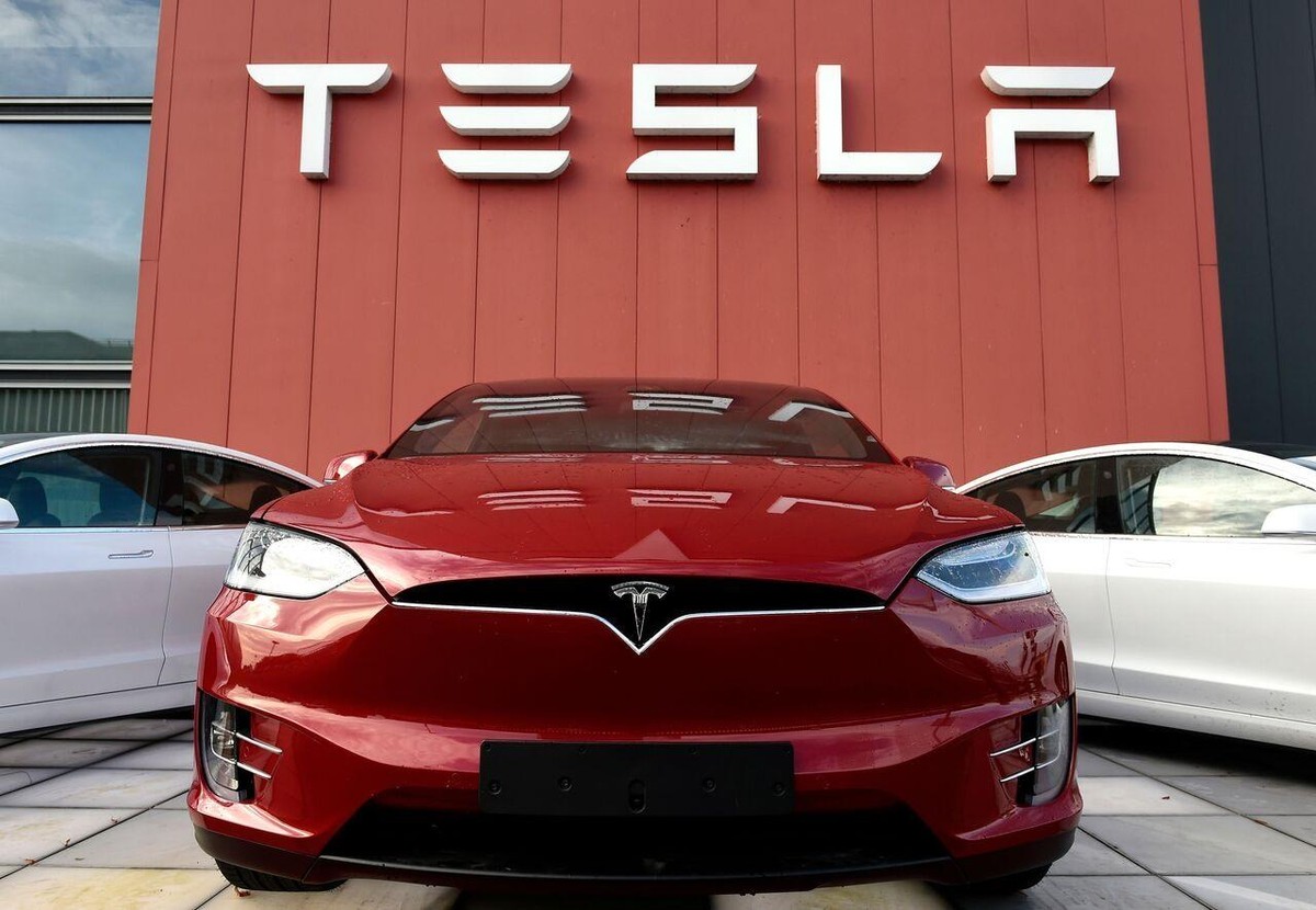 Cuộc chiến của Elon Musk - Tim Cook ở Trung Quốc: Tesla chiến đấu với giá cả, Apple luôn kiêu ngạo ảnh 1