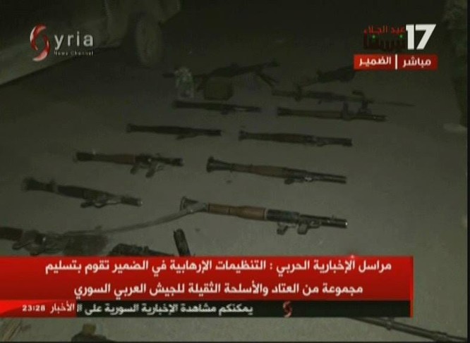 Chiến binh Hồi giáo lũ lượt xin hàng, giao nộp vũ khí cho quân đội Syria ảnh 4