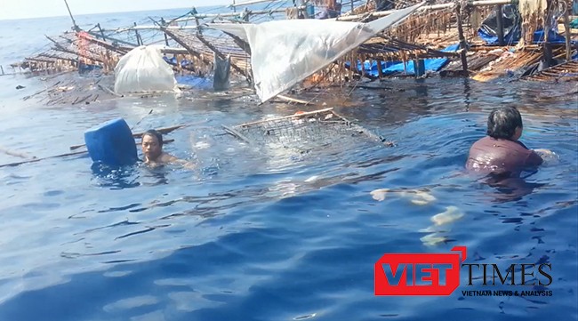 Ngư dân trên tàu cá QNa 95959TS phải bám vào can nhựa, vật lộn giữa trùng khơi để giữ tính mạng. 