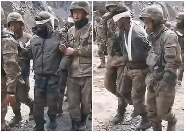Hình ảnh binh sĩ Ấn Độ bị thương bị lính Trung Quốc bắt dẫn giải (Ảnh: Đông Phương).