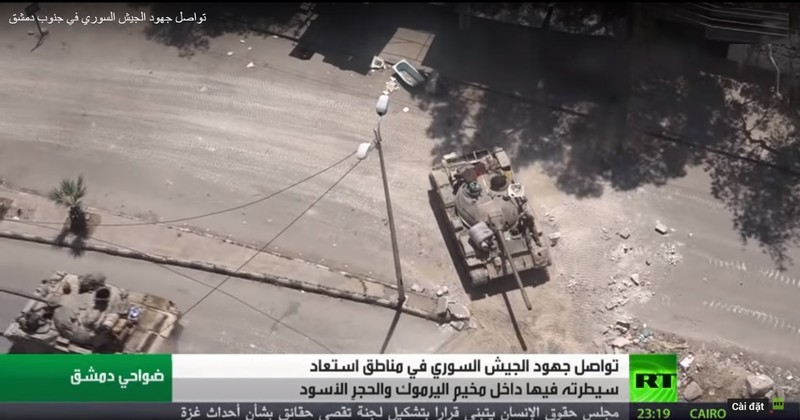 Quân đội Syria, Plesstine tấn công quận Hajar Al-Aswad.Ảnh RT