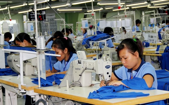 Lao động đang làm việc tại một nhà máy may mặc - Ảnh minh họa: Quốc Hùng