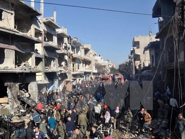 Hiện trường vụ đánh bom xe ở Homs. (Nguồn: AFP/TTXVN)