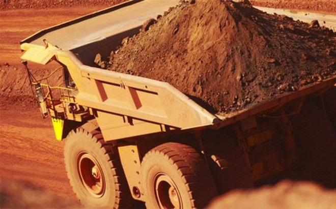 Gánh lỗ đậm, BHP Billiton, một trong những công ty khai mỏ lớn nhất thế giới, buộc phải cắt giảm cổ tức trả cho cổ đông - Ảnh: BBC