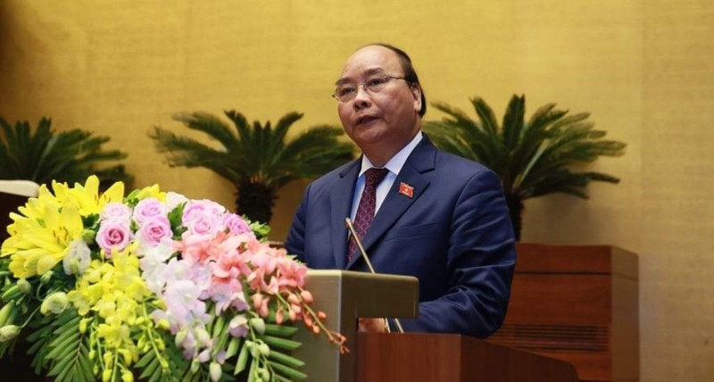Thủ tướng Nguyễn Xuân Phúc trình bày báo cáo trước Quốc hội. Ảnh VGP/Nhật Bắc