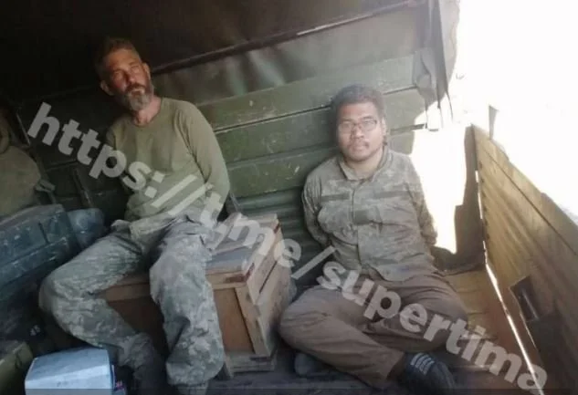 Bức ảnh hai lính Mỹ bị Nga bắt được đăng tải trên Telegram (Ảnh: QQ).