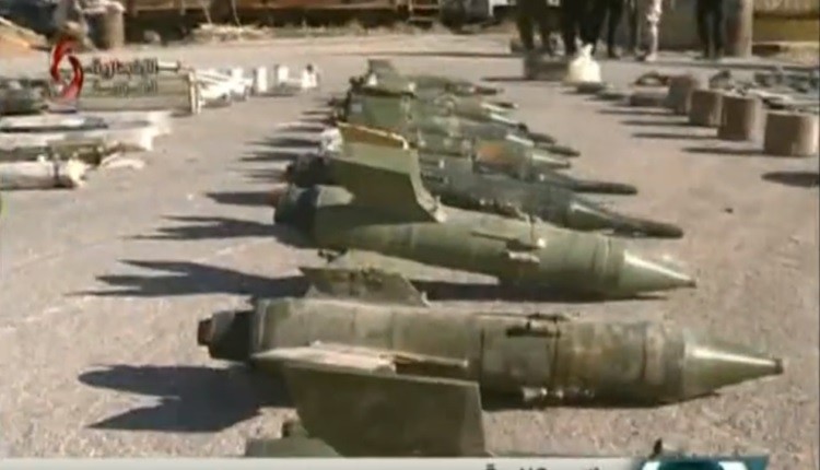 Vũ khí phi pháp bị an ninh quân đội Syria thu giữ - ảnh video truyền thông Syria