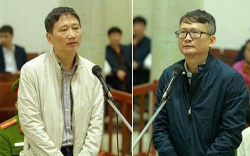 Bị cáo Trịnh Xuân Thanh và bị cáo Đinh Mạnh Thắng tại tòa. Ảnh: TTXVN