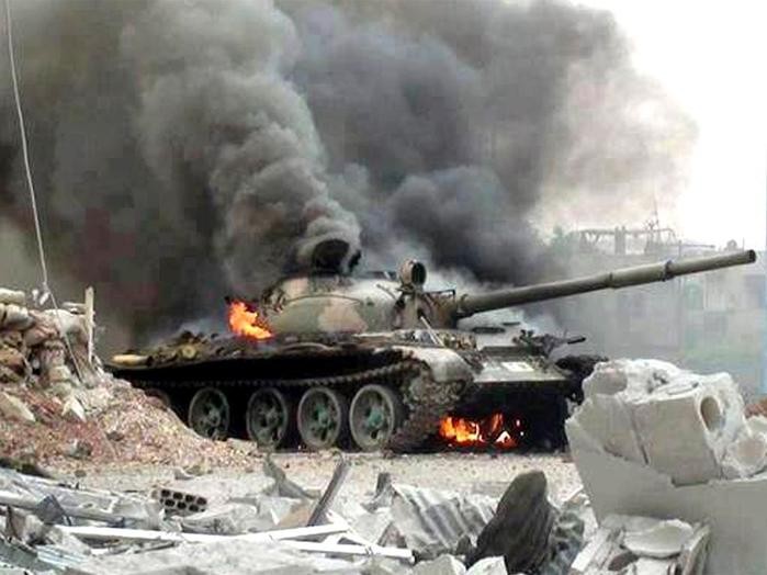 Xe tăng Syria bốc cháy do trúng tên lửa chống tăng, ảnh minh họa của Masdar News