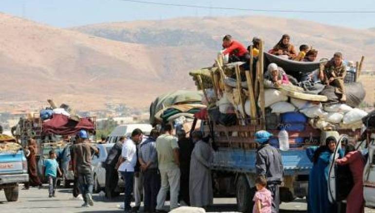 Những người dân di tản Syria trở về từ các nước láng giềng lân cận. Ảnh minh họa Masdar News