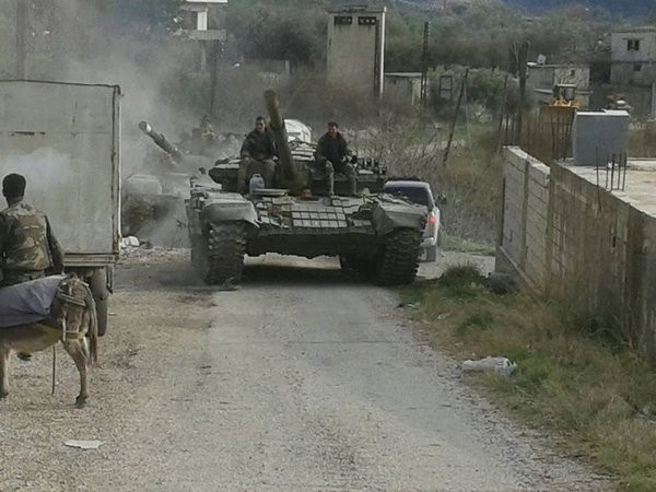 Quân đội Syria trên chiến trường vùng nông thôn Latakia. Ảnh minh họa Masdar News