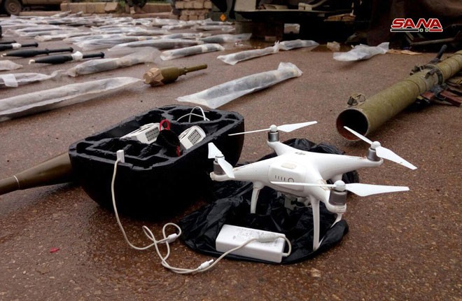 Vũ khí và máy bay trinh sát không người lái UAV, được thu giữ tại Daraa. Ảnh: SANA.