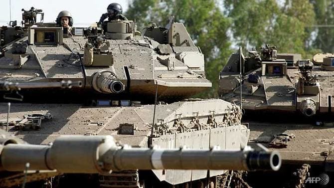 Xe tăng Merkava của Israel hoạt động trên Cao nguyên Golan (Ảnh: AFP)