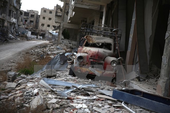 Cảnh đổ nát sau các cuộc giao tranh giữa quân đội chính phủ Syria và phiến quân tại Jobar, ngoại ô thủ đô Damascus ngày 23/1. (Nguồn: AFP/TTXVN)