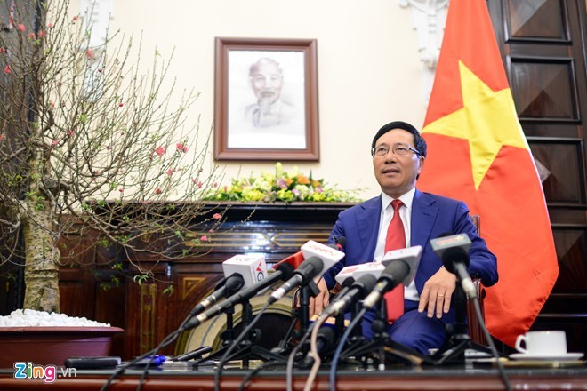 Phó thủ tướng Phạm Bình Minh tại buổi gặp gỡ báo chí đầu năm. Ảnh: Tiến Tuấn.
