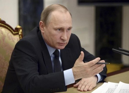 Tổng thống Putin chủ trì một hội nghỉ ở Điện Kremlin hôm 16-3. Ảnh: Reuters