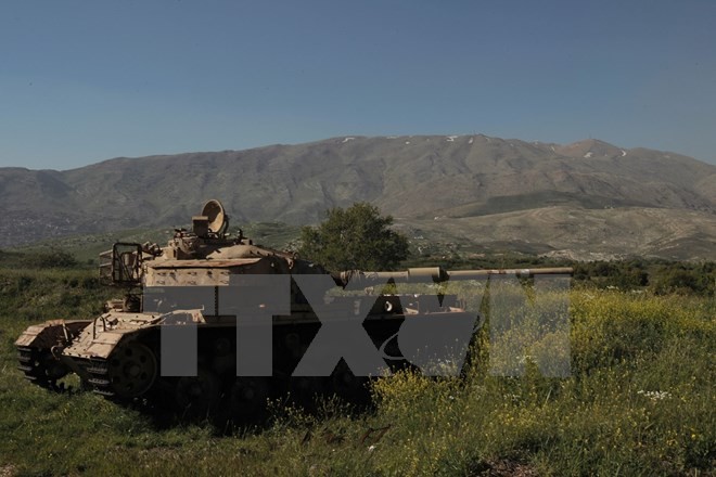 Xe tăng Israel trên vùng đất chiếm đóng của Cao nguyên Golan, giáp giới với làng Hadar của Syria ngày 17/4. (Nguồn: AFP/ TTXVN)