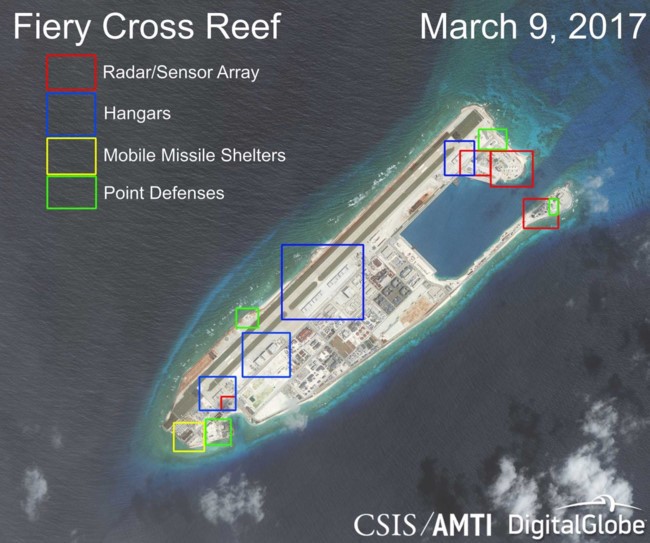 Trung Quốc bồi lấp trái phép Đá Chữ Thập tại quần đảo Trường Sa thành đảo nhân tạo phi pháp với đường băng dài 3.000m, hải cảng và các công trình quân sự kiên cố